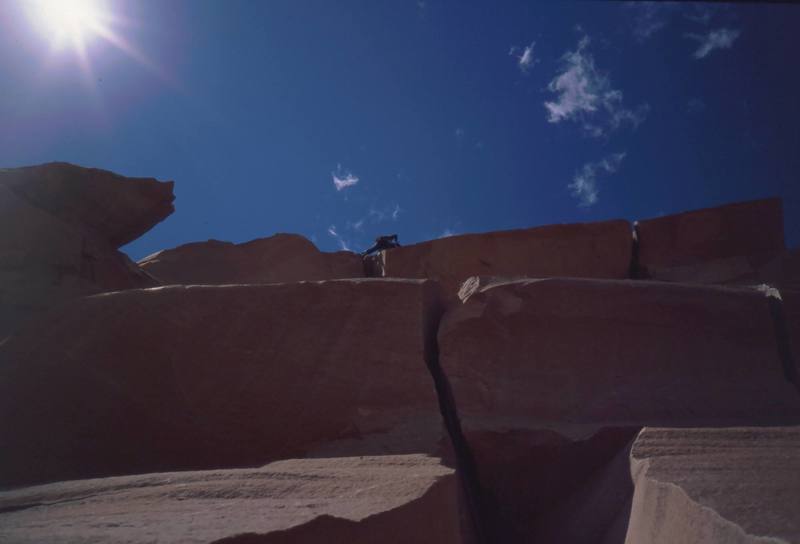 Tony Bubb high overhead on the hand and fist pitch of 'Lightning Bolt Cracks (5.11)' on North Six Shooter Peak. Photo by Joseffa Meir, 1998(?).