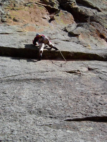 Luke making the P1 crux move. The guidebook calls this 10d, but we all felt it was more like 10b, and very obvious.