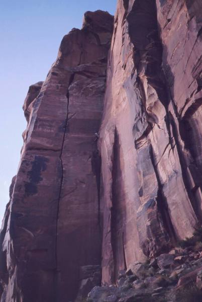 Tony Bubb turning the steep section of 'Our Peice of Real Estate' (5.11a) to continue for the rest of this long and worthy route. Photo by Eric Corkran, 2001.