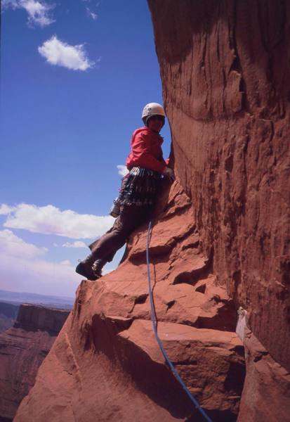 Joseffa Meir traverses out to some wild exposure on 'Honeymoon Chimney (5.11a)'. Note the tilt in the background- this section of climbing is actually steeper than it looks at first. Photo by Tony Bubb, 2003.