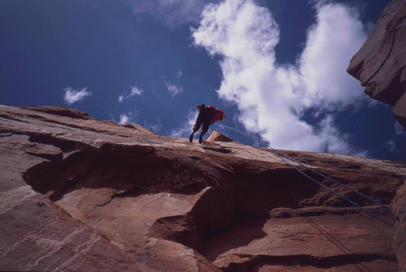 Joseffa Meir raps down from the summit of 'The Priest' in Castle Valley. Photo by Tony Bubb, 2003.