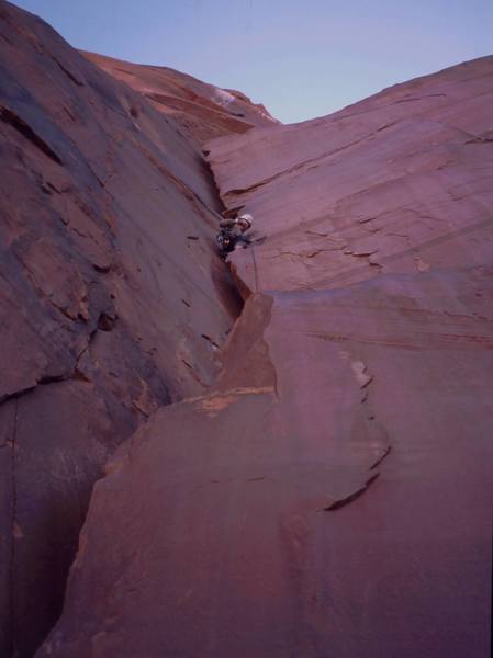 Tony Bubb a few meters up Honeymoon Chimney's first pitch, where it is merely awkward, but before it turns to a grovel. Photo by Joseffa Meir, 2003.