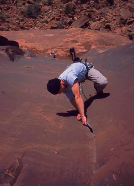 Josh Janes about to finish on 'Ice Cream Parlor Crack (5.11a). Photo taken from the anchors by Tony Bubb, 2004.