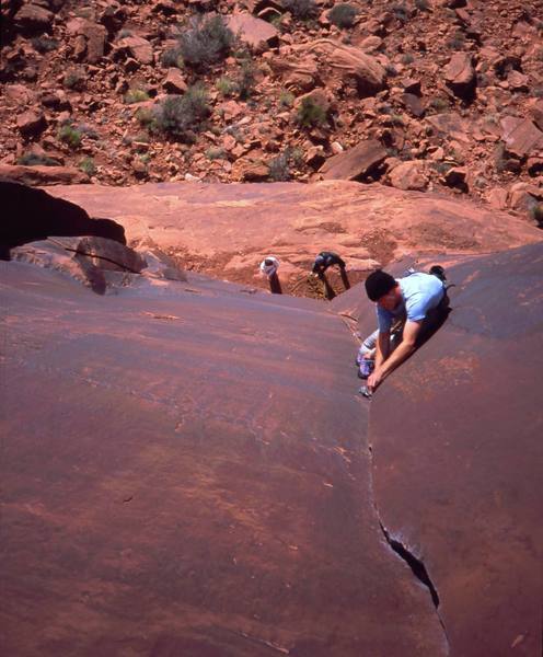 Josh Janes just getting started on 'Ice Cream Parlor Crack (5.11a). Photo taken from the anchors by Tony Bubb, 2004.