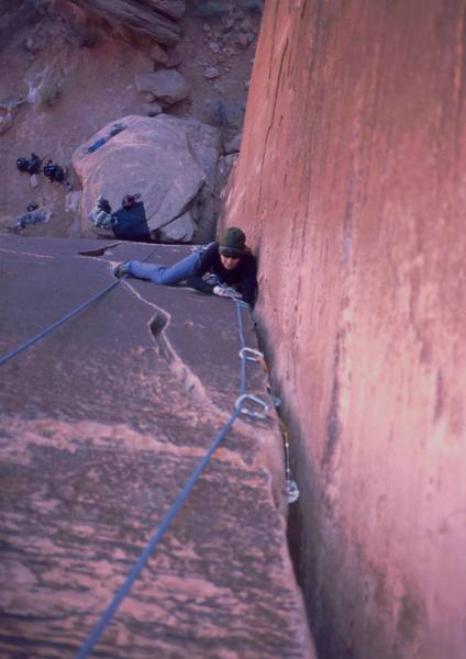 Joseffa Meir follows 'Hot Toddy (5.10)' at Maverick Buttress in Long Canyon, UT. Photo by Tony Bubb, 2003.