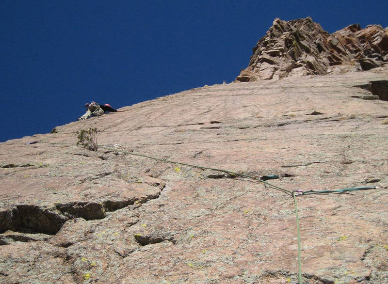 Climbing the awesome steeper-than-it-looks-in-this-photo arete on pitch two of The Odyssey. The face right of the arete is very clean and begging for an FA.