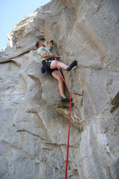 Making the crux reach on Aftershock, 5.10d.