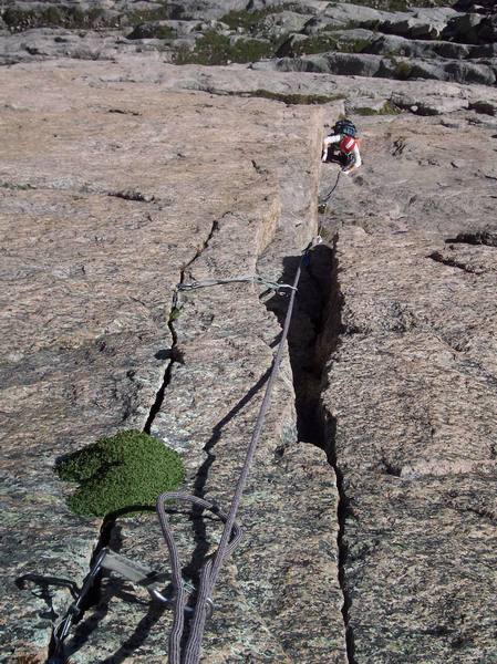 Pennie Schwalm entering the dihedral on the first pitch.