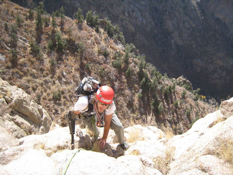 Aron finishing up P3 into a nice "belay dish" just right of the bushy gully that is frequently belayed from.