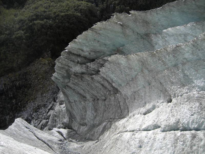After looping back down the west coast, it was time to strap on the crampons and head out for a climb on the Franz Joseph glacier.  After ten minutes of hiking steeply up the terminal face of the glacier, we encountered this unusual 80' tall formation.  Clearly this breaking wave of ice needed to be climbed...