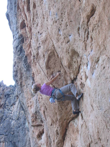 Contemplating the first crux, pulling the obvious bulge.  Another crux is found right at the last bolt, turning an awkward dihedral roof.