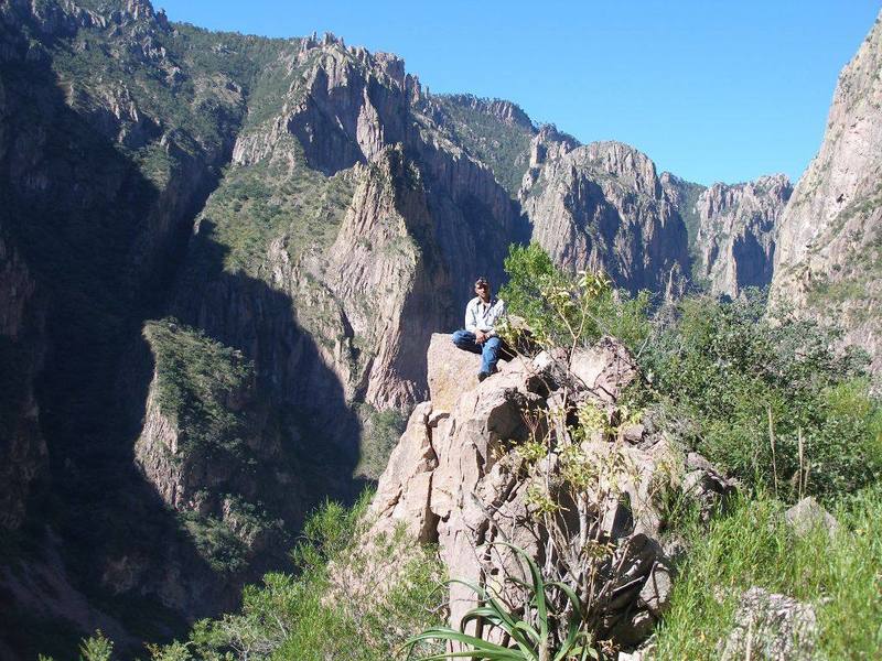 Our guide in repose on the shoulder of El Gigante, the start of the Man on Fire route.  Behind him is the canyon descending from the 1,000' waterfall.