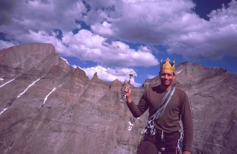 King of the Mountain, or just Burger King? Tony Bubb wields the ruling scepter of the #5 HB quadcam and the royal crown on the summit of the Spearhead. Longs Pk and Mt. Pagoda are in the Background. Photo by Joseffa Meir, Y2K.