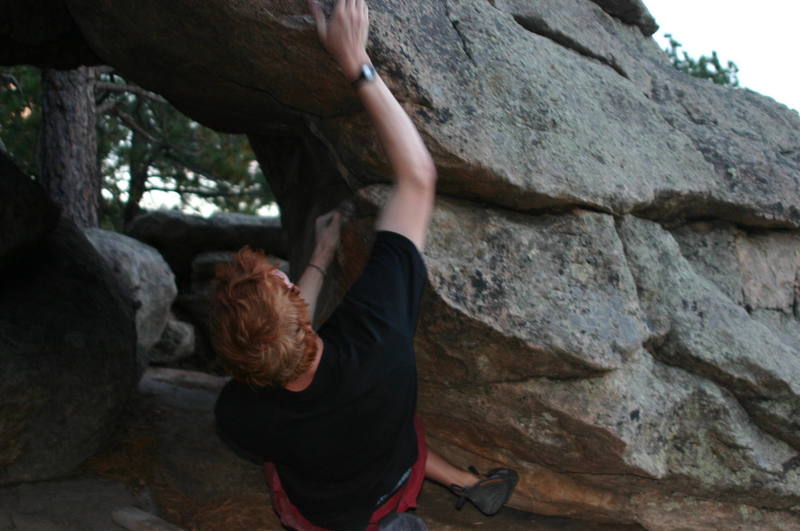 coming off a tricky dyno bouldering at Three Sisters Open space, Evergreen Colorado