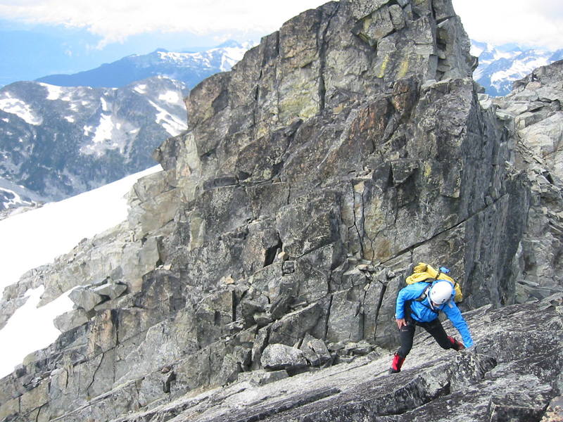Ted, after downclimbing the fourth class section which is visible behind and above him (essentially, you downclimb the face from the cut off peak).