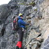 Downclimbing some the rock above the initial snow section.  The loose and steep nature of the route is pretty obvious.