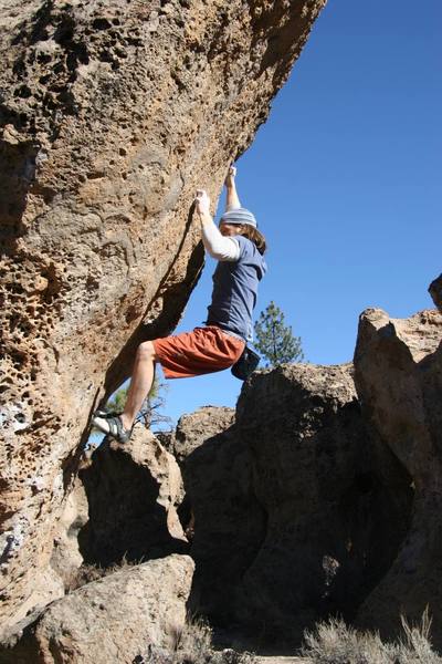 Sticking the crux move on Looks Like We're One Horse Shy Partner, V5