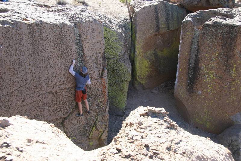 Contemplating the crux sequence on, Ride the Very Thought to the Ground - V1