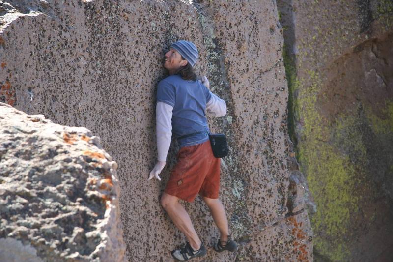 Midway through the crux sequence on, Ride the Very Thought to the Ground - V1