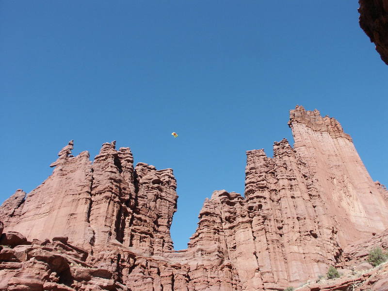 Jimmy P. (next is Wayne C.) after base jump from the "diving board" on the rim rock - crazy sight. . . .