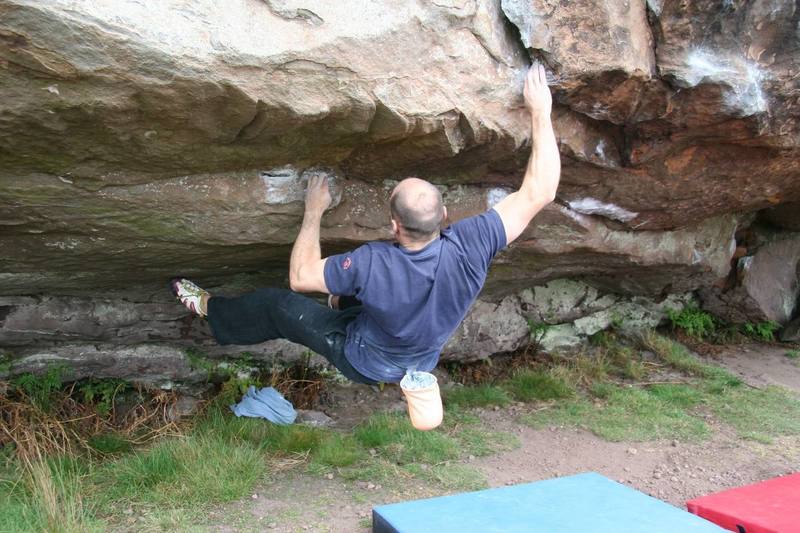 Reaching out to the lip of Cave Central RH, V5