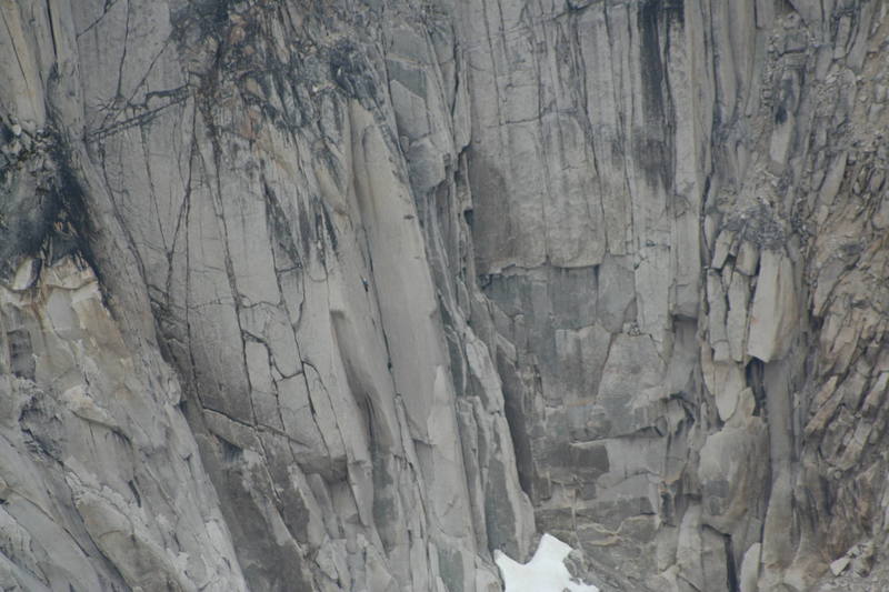 Climbers on the crux pitch of McTech Arete. This photo was taken from the south summit of Snowpatch Spire using a telephoto lens.