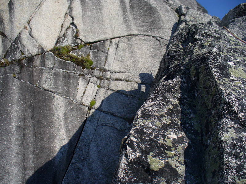 Here I am (in shadow) belaying on one of the lower pitches of the Snowpatch route, Snowpatch Spire