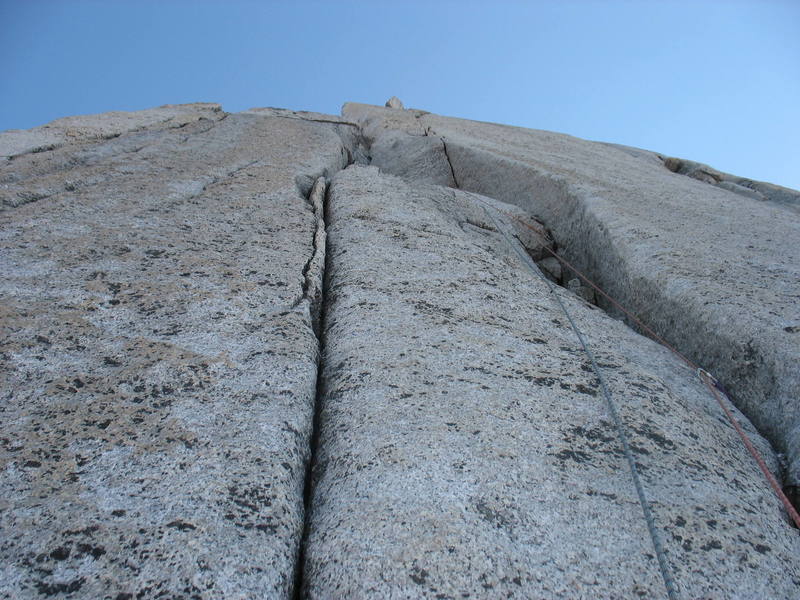 The first pitch of the Great White Headwall climbs a short 5.10 offwidth/fist crack, then up these steep 5.9 cracks to the belay