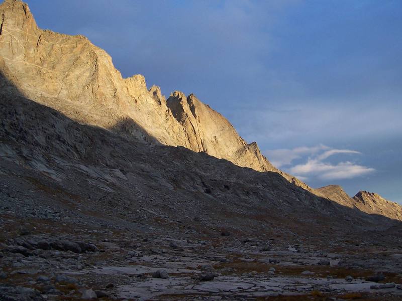 The steep west face of Fremont Peak. A few routes ascend these tall buttresses and faces. To the left and in the foreground is Mt. Sacagawea.
