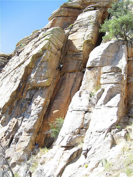 Erica Bigio cruising the crux. On a warm day this and the dihedral in the middle of the cliff go into the shade so you can keep climbing when the faces may seem too warm.
