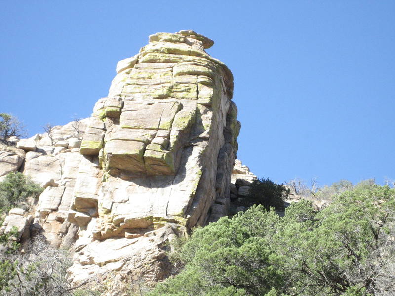 Climbs seam that leads to right side of roof then up right facing dihedral.