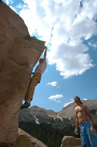 Right side of the classic Shoulder Boulder Arette, The Larry is climbing w/o his trademark cowboy hat, while CHill spots w/ cig in hand.