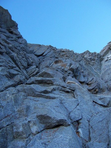 Looking at the first roped pitch of West Arete of Winchell. From here it goes up and left through cracks and flakes. Mostly moderate 5th class with a few spots of 5.8-5.9 - July 2007<br>
<br>
Photo (c) by Pavel Kovar