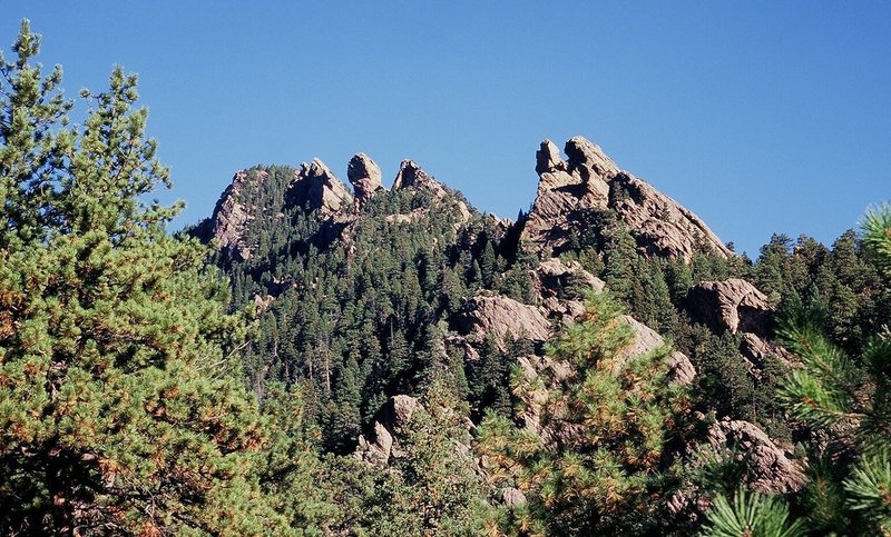 Shadow Canyon from the Mesa Trail at midmorning. The crags on the right-side skyline, from near to far, are:<br>
Tower Of the Moon & Jamcrack Spire<br>
The Pyramid<br>
Devil's Thumb<br>
West Face of Devil's Wings<br>
Sunset Wall.<br>
Photo by Tony Bubb, 11/07.