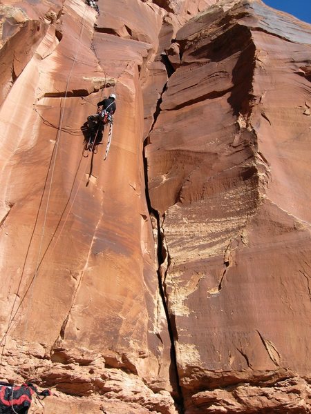Route II is to the right of the person in the large looking crack.