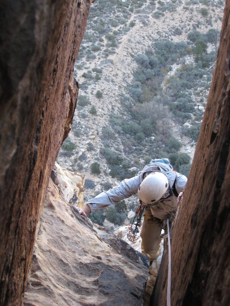 I think this is just prior to entering the last slabby chimney at the top of p5. You can see the trail into Icebox below my brother in the distance. November 07