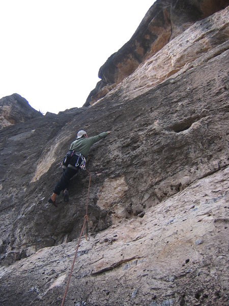 Cruxing on route #12, 5.10b, one of the best lines on the wall.
