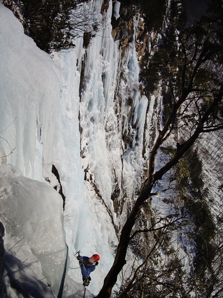 Last Gentleman, 4th pitch seen from the belay. Pat McCarthy climbs the remaining ice. Promenade in the background.