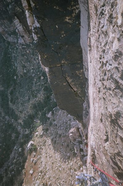 Looking down from the fourth belay station. A semi-hanging belay which obviously has great exposure