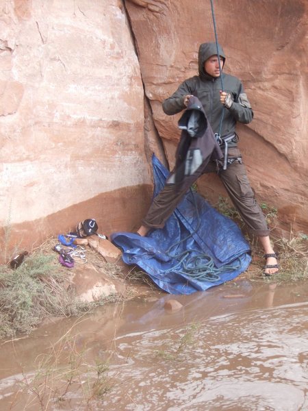 Uknown belayer at the base of Static Cling. This route has a 500 foot over hang above it. So, it remains bone dry even in a downpour. I took the photo. I don't know who the climbers are.