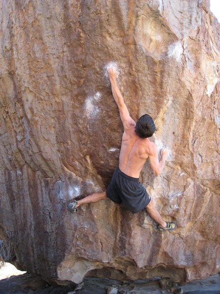 The first of two crux moves, hitting the high 1/2" crimp. This move is a bit reachy.