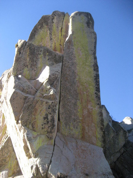A wicked looking crack on the Col between the Wedge and the Tooth (On the Wedge side). I'd guess it's never been climbed, especially due to the long approach for a single pitch. But it sure looks nice.