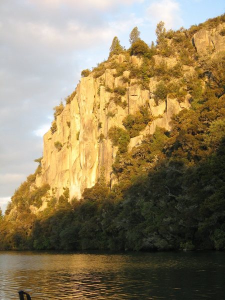 Whanganui Bay has some good trad lines. The setting is really gorgeous as well. Its around Lake Taupo. If you zoom in you can see me climbing up the cliff.