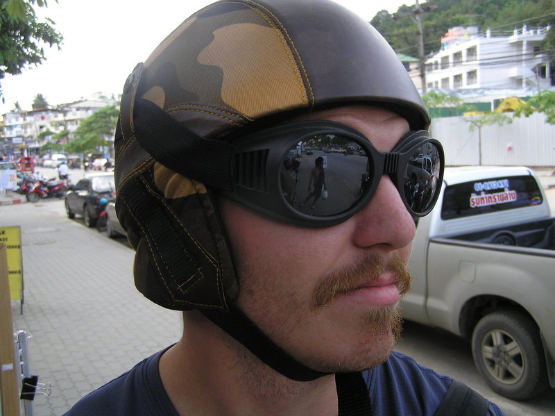 Me wearing a motorcycle helmet and goggles, rockin the 70's pornstar 'stache.