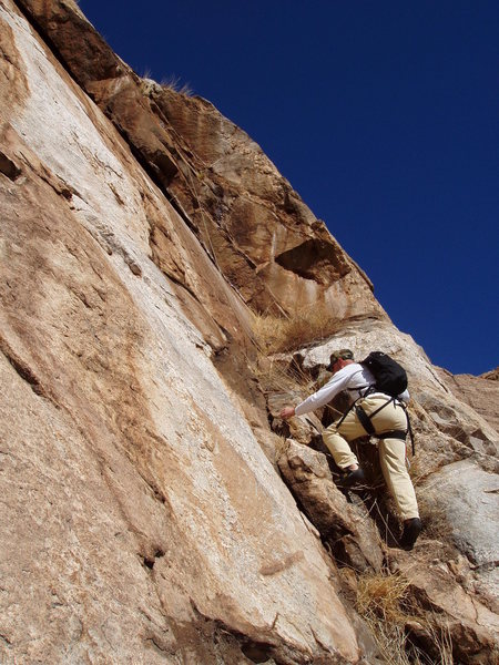 Start of Pitch 3. Dusty climbs toward two-tiered dihedral.