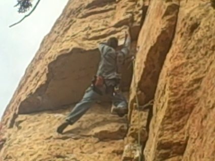 Aaron pulling out of the "Wadsworth Blvd. (5.10)" roof at Shelf Road Canon City, CO