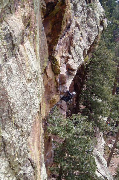 Pulling the roof on P1. Unknown climber.