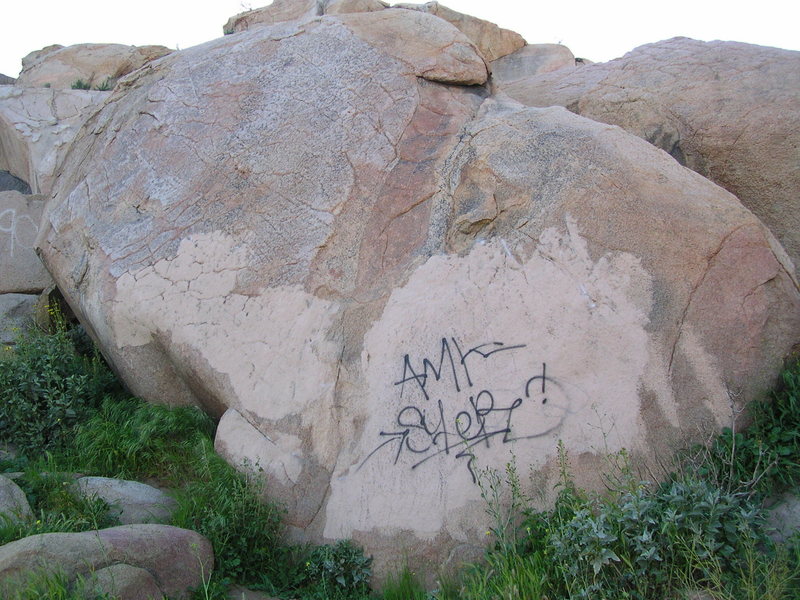 "Dutzi" climbs right up through the fairly recent tagging, which was done over a bad paint-over of previous graffiti. The cycle never seems to end.