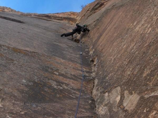 Leading up one of the many 5.11 pitches low on the route.