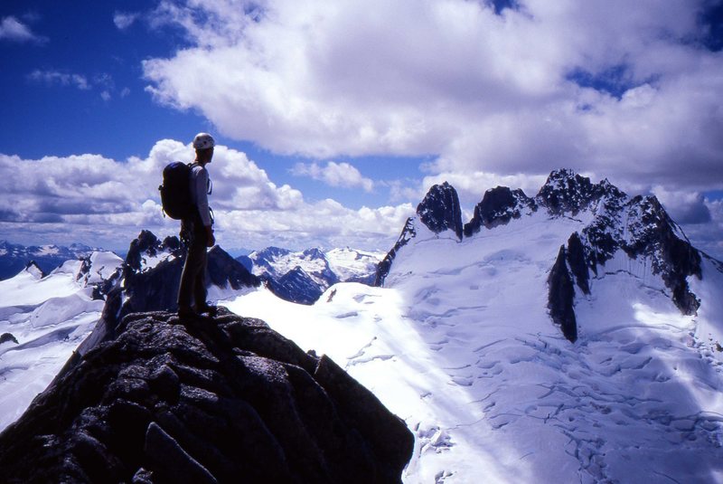 Kurt Johnson looking toward the Howser Towers from near the summit of Bugaboo Spire. Photo by Chad Bennett.